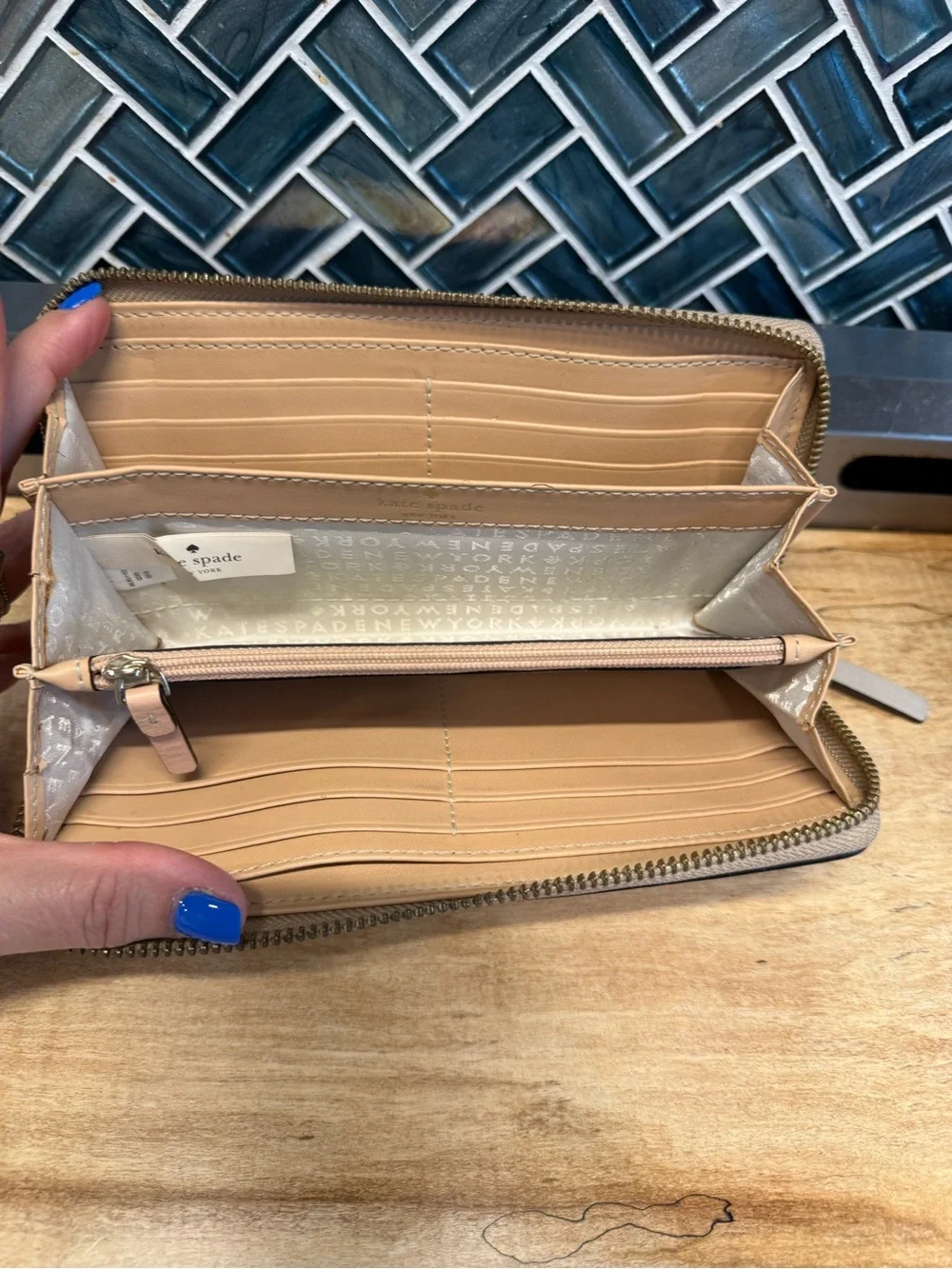 kate spade Pebbled Zip Wallet in cream/beige